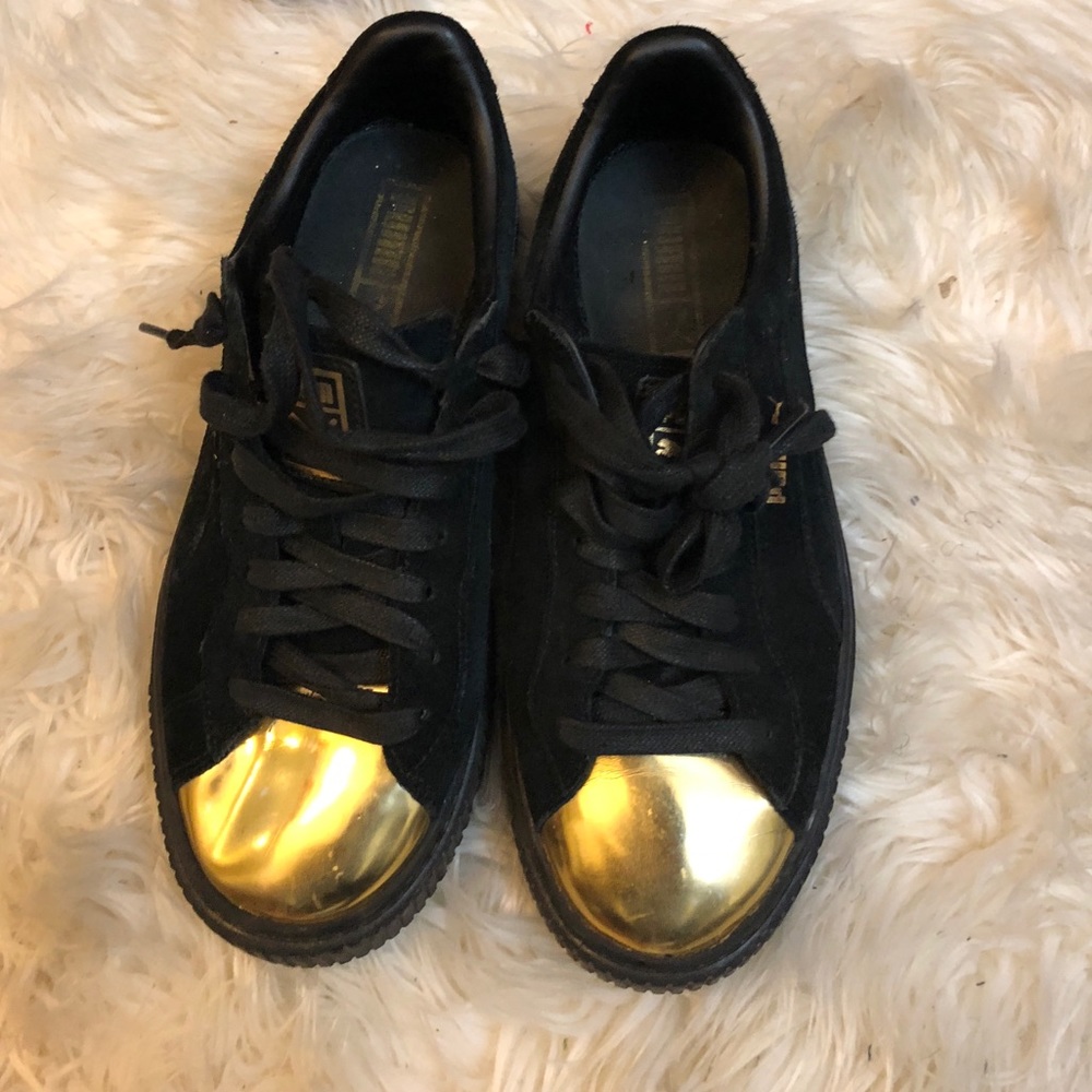 Black and gold fenty pumas